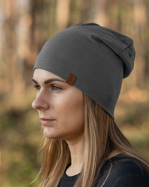 Women in the forest wearing menique Women's Merino Beanie Hat Perfect Grey Color