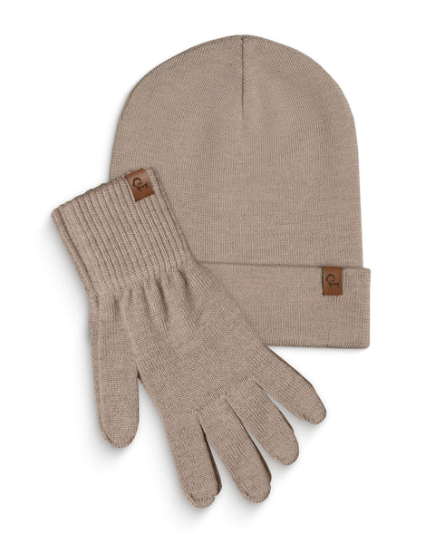 Creamy Beige knitted beanie and a pair of matching gloves are laid flat against a white background. Both the beanie and each glove have a small, rectangular brown leather tag with a menique logo on them. The items are slightly overlapping, with the beanie positioned above and to the left of the gloves.