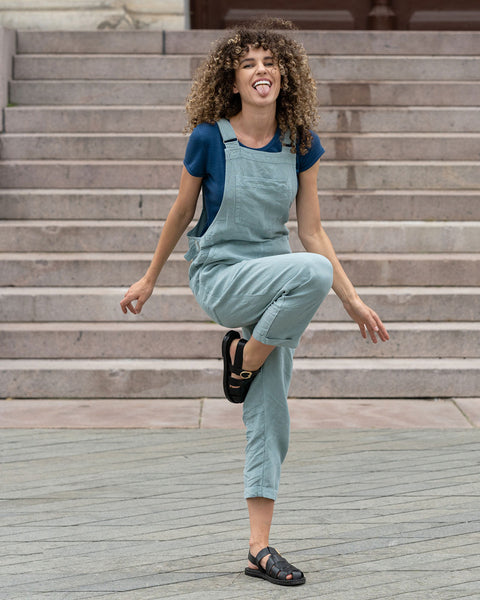 Gorgeous woman in a city, wearing mint green linen Jumpsuit Nicci.