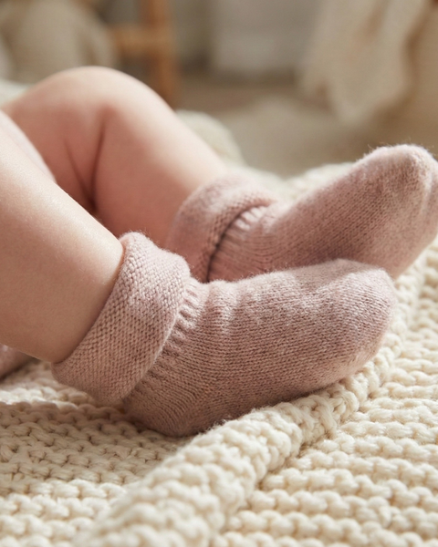 Baby merino wool socks in dusty pink, gentle knit infant booties made from soft breathable merino wool