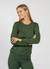 Smiling woman and wearing dark green merino wool matching set