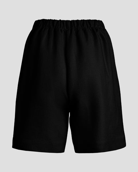 Packshot showing the back of linen high-waisted shorts.