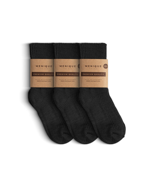 Three pairs of dark gray ribbed thick socks for children, bundled together with Menique branded brown paper wraps labeled ‘Premium Quality.