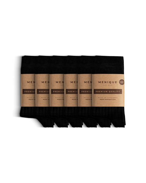 Set of six pairs of black ribbed thin children’s socks, each packaged with Menique’s eco-style brown paper bands labeled ‘Premium Quality.