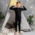 menique 160gsm merino black pants for kids, front view.