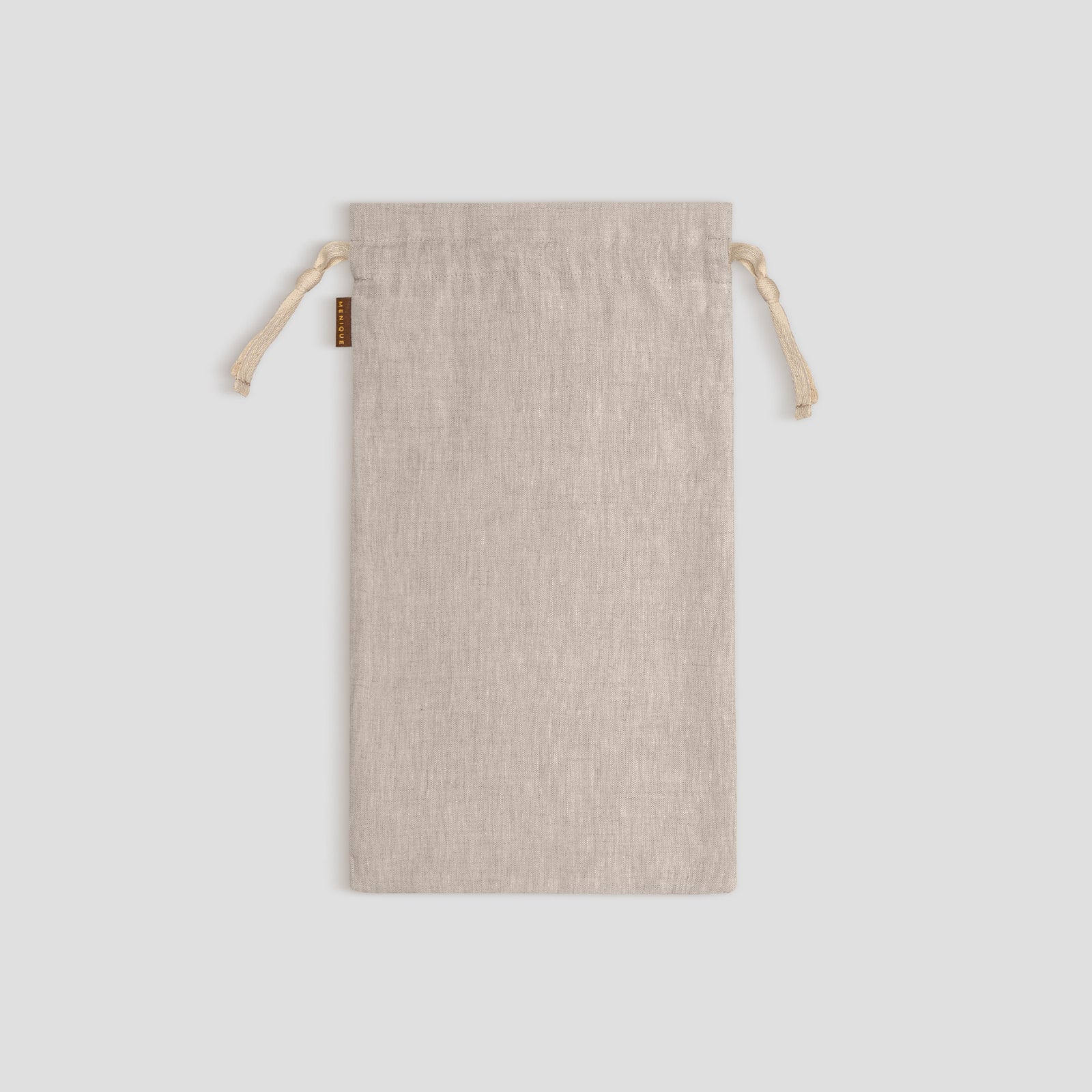 Stone Green drawstring bag on a light gray background