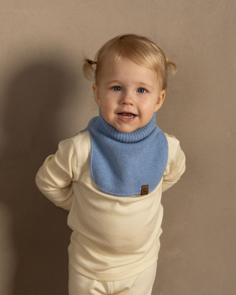 Baby wearing light blue Merino wool knit dickie, soft thermal neck warmer for infants and toddlers