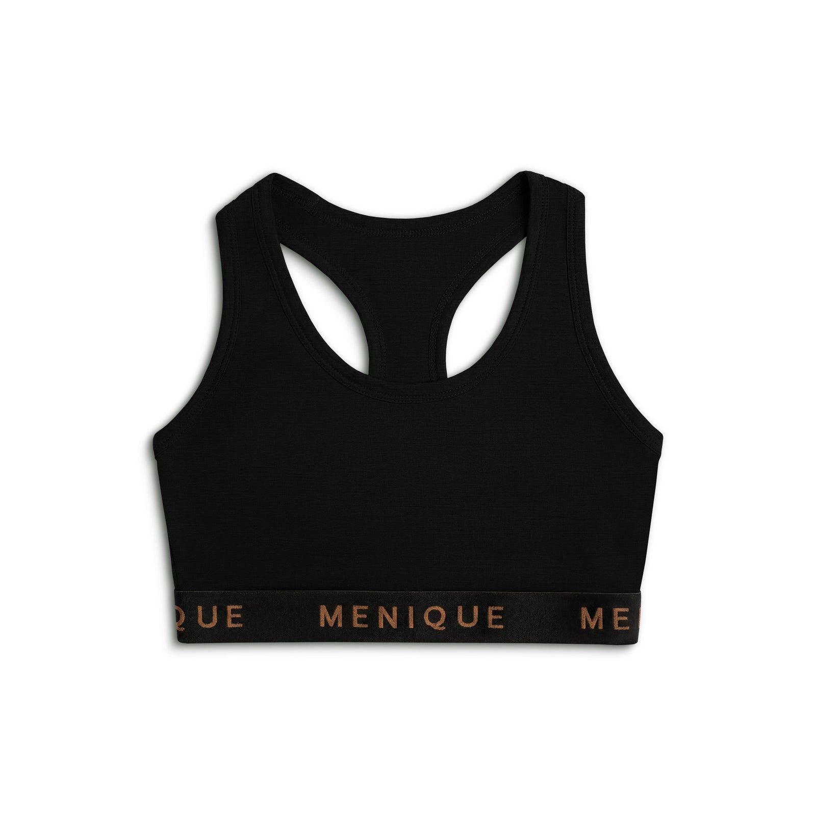 Woman wearing a black Merino wool sports bra with racerback design, posing with one arm raised.