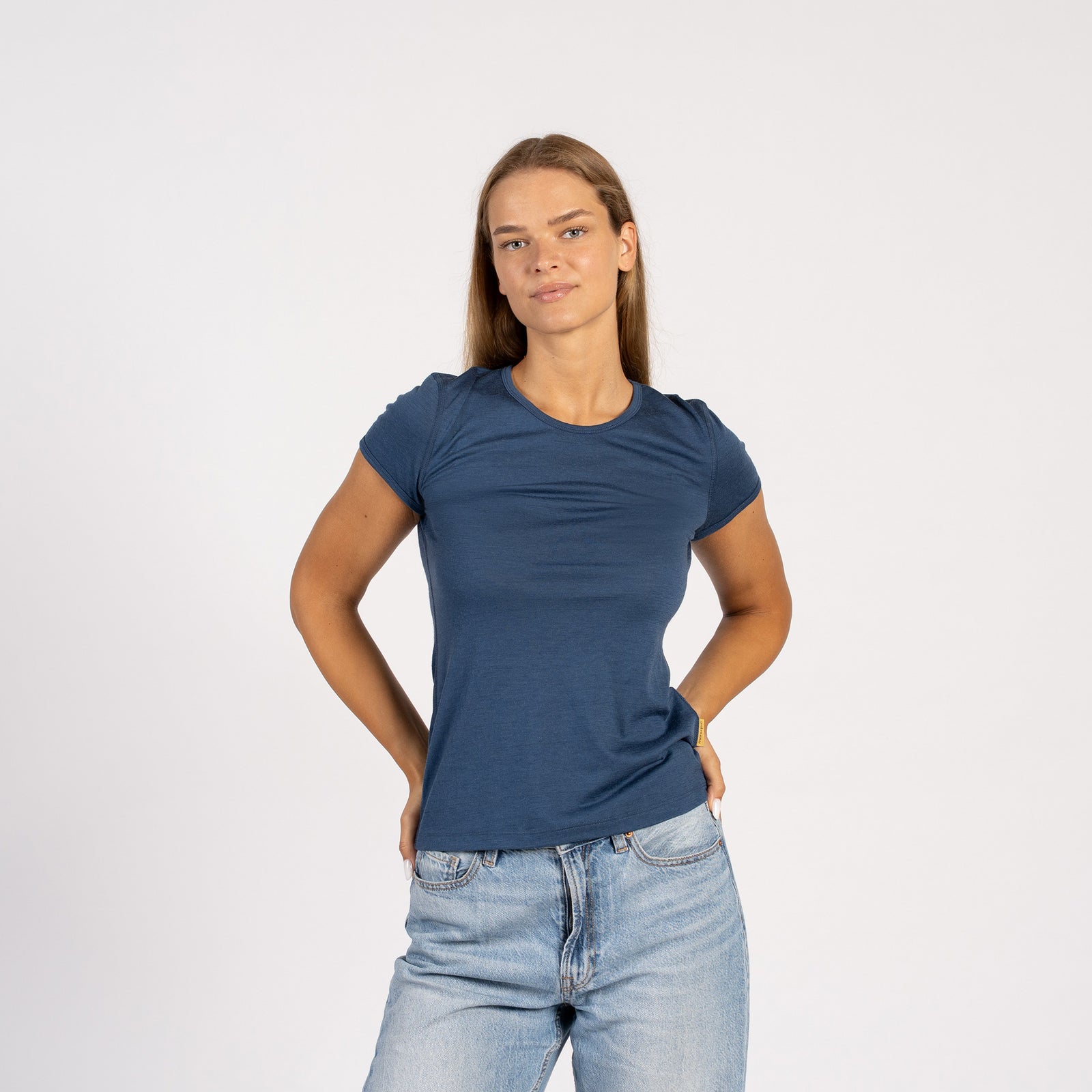 Side view of model wearing denim Merino T-shirt – soft lightweight wool tee
