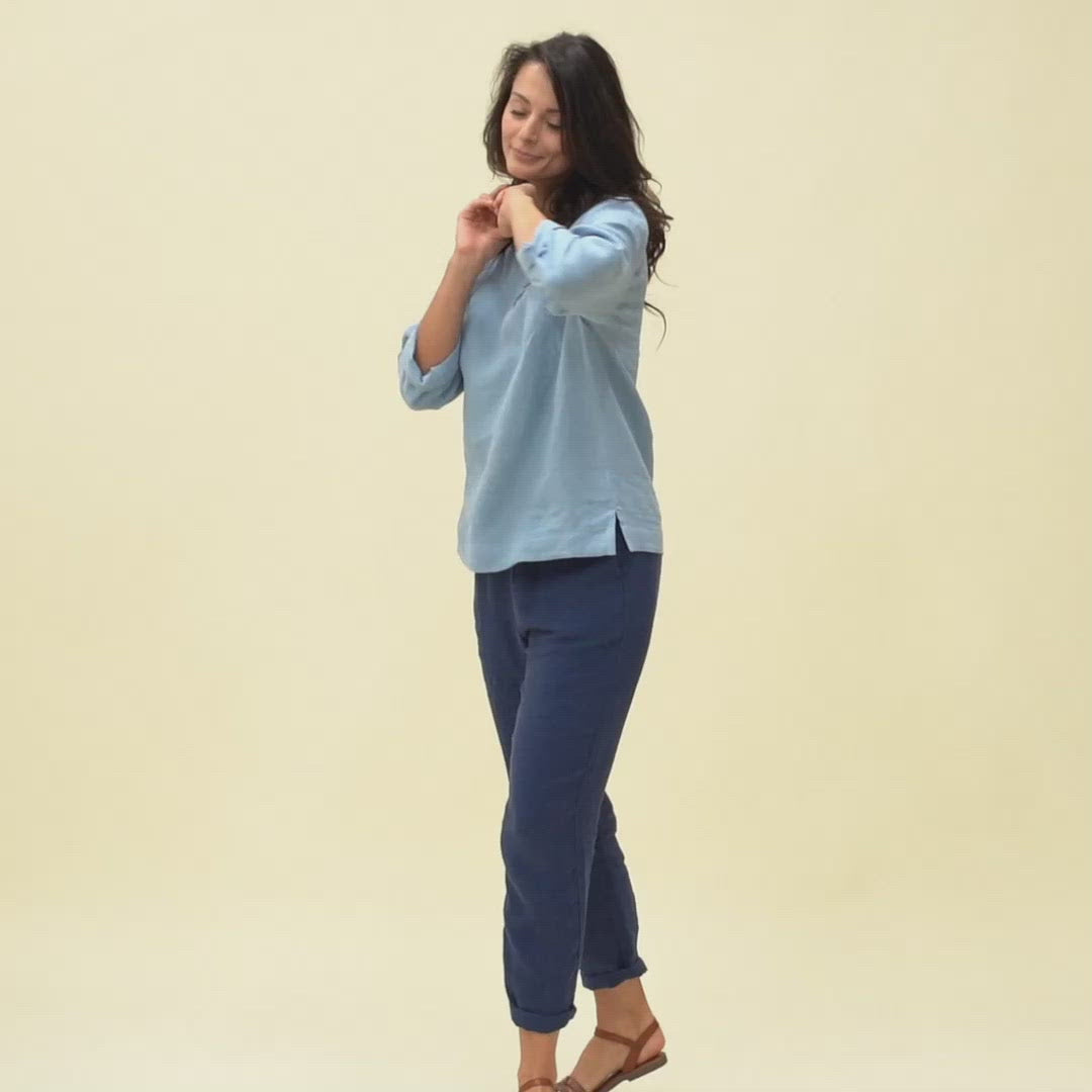 Woman wearing linen blouse in cloudy blue color video