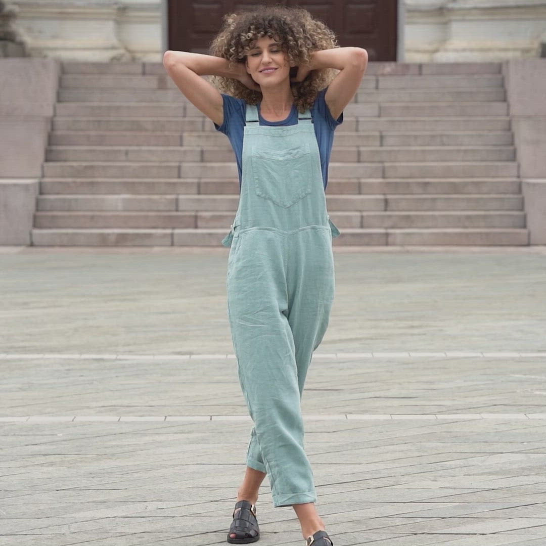 Gorgeous woman in a city, wearing mint green linen Jumpsuit Nicci.